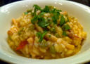 Risotto con Calamari in Umido con Piselli e Pomodorini