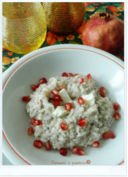 Risotto al profumo di melograno, formaggio morbido e semi di papavero