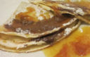 crepes al cioccolato con salsa all'arancia