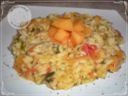 Risotto con melone, rucola e pachino