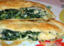 Panzerotto gigante con spinaci, funghi e gruyère