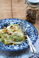 Ravioli di borragine e ricotta di capra con crema al Parmigiano e nocciole tostate