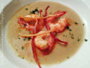 Gamberoni al curry, flambati al Brandy, in crema di ceci di Cicerale e peperoni croccanti