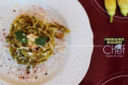 Spaghetti con fiori di zucca, pesto e crema di parmigiano