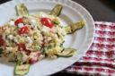 Cous cous tricolore con zucchine, pomodorini e giuncata