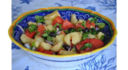 Insalata di patate, olive nere, cuori di bue e cipolla rossa di Tropea.