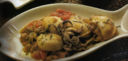 Seppie in umido con pomodori e toscanelli.