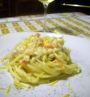 Spaghettoni con persico e salmone selvaggio al profumo di arancia e finocchietto