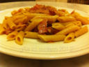 Penne integrali con speck e paté di olive