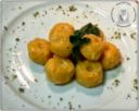 Gnocchi di zucca ripieni di fonduta al pistacchio, succo di zenzero e amaretti