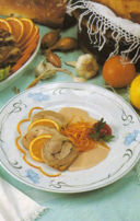 Rollè di tacchino in salsa d'arance.