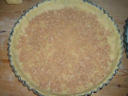 Crostata di pere e cioccolato e fondo di amaretti.