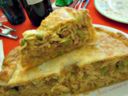 Timballo di tagliatelle salsiccia e piselli, ricetta primi piatti