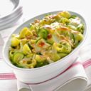 Gratin di pasta con robiola, zucchine e pinoli