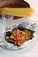 Spaghetti con frutti di mare al cartoccio