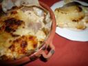 Patate gratinate al latte e formaggio