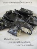 Ravioli al nero con baccalà mantecato e burro aromatico