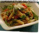 Penne integrali con pomodorini gratinati, rucola e ricotta