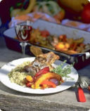 Arrosto di costolette di agnello e zucca.