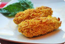 Polpettine di pollo fritte con panatura di corn flakes.