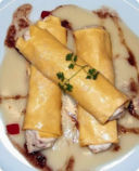 Cannelloni di ricotta e baccalà con salsa di cavolfiore al profumo di alici.