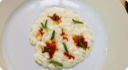 Risotto alla burrata con ricci e asparagi di mare.