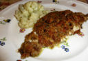 Filetti di branzino in crosta con olive,capperi e formaggio
