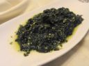 Contorno di spinaci in padella con acciughe e pistacchi