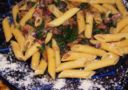 Penne con radicchio e speck mantecate al montasio