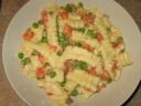 Ricette pasta: rigatoni con carciofi panna piselli e pancetta