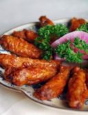 Ali di pollo al forno nel succo di limone e miele