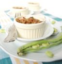 Ricetta Baccelli di fave gratinati con salsiccia e pomodorini in cocotte