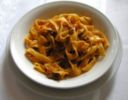 Tagliatelle al ragù di prosciutto e funghi secchi