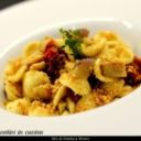 Orecchiette con melanzane, pomodori secchi e muddica atturrata