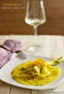 Raviolo aperto con baccalà e fiori di zucca su crema allo zafferano