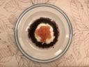 Riso nero con stracciatella e gamberi rossi